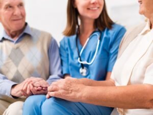 old-man-woman-sitting-yellow-sofa-with-nurse_23-2148238969.jpg